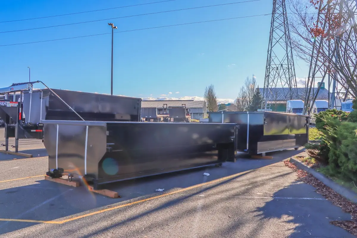 Roll-off dumpster ready for waste disposal at job site for Demolition Dumpster Rental in Goffstown